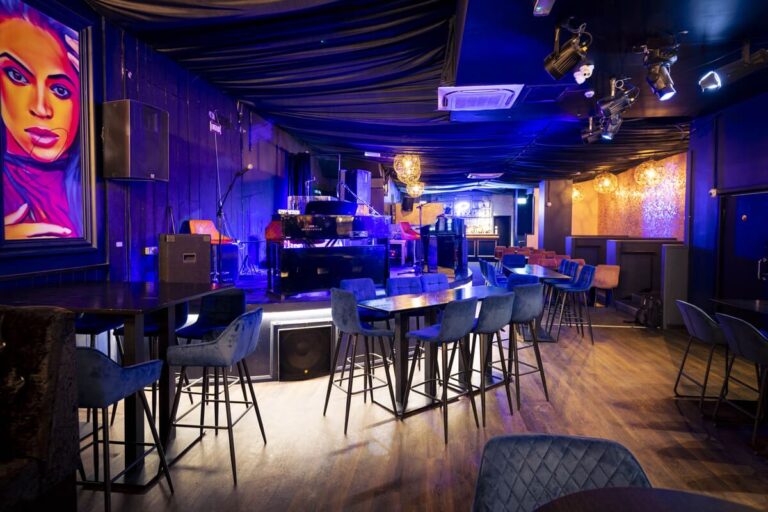 Stage and lounge seating at live music venue hire in Reading